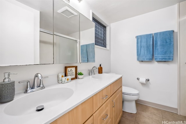 bathroom featuring toilet, tile patterned flooring, an enclosed shower, and vanity