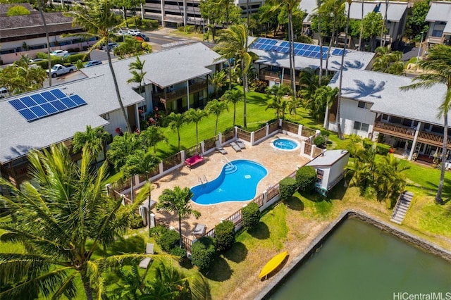 birds eye view of property with a water view