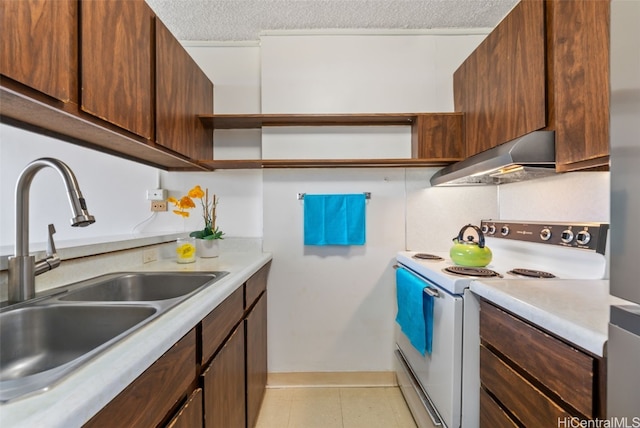 kitchen with decorative backsplash, white electric range oven, sink, and a textured ceiling