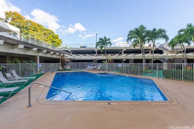 view of swimming pool with a patio area