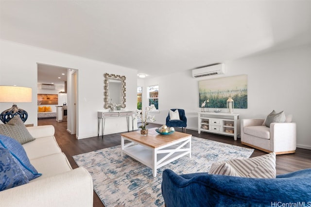 living room with a wall mounted air conditioner and dark wood-type flooring