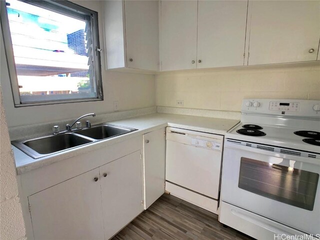 kitchen featuring dark hardwood / wood-style floors, white cabinetry, sink, and white appliances