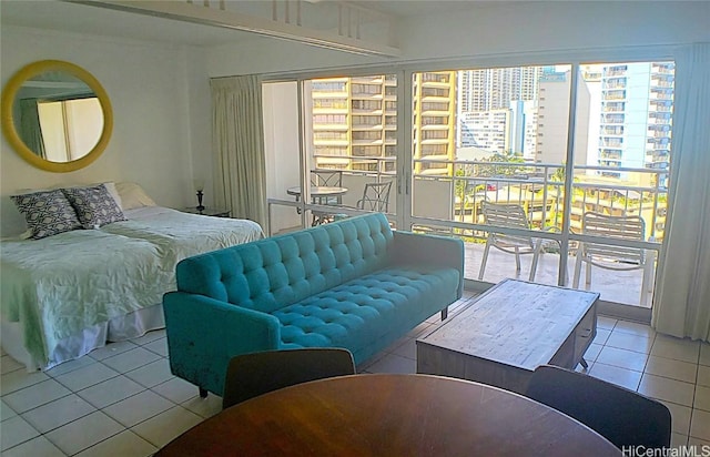 tiled bedroom featuring access to outside