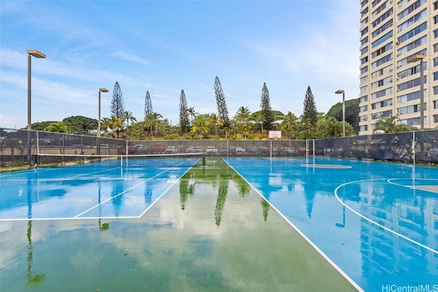 view of sport court with community basketball court and fence