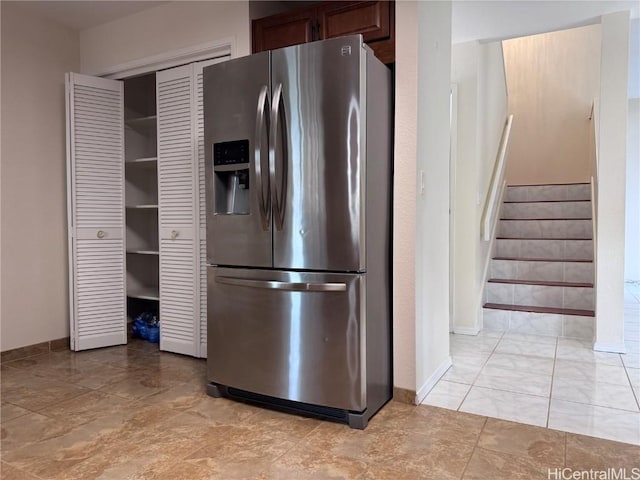 kitchen with stainless steel refrigerator with ice dispenser