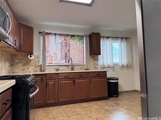 kitchen with sink and range with gas stovetop