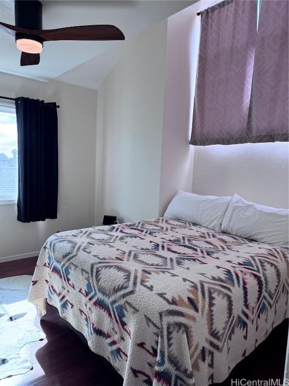 bedroom featuring ceiling fan and hardwood / wood-style floors