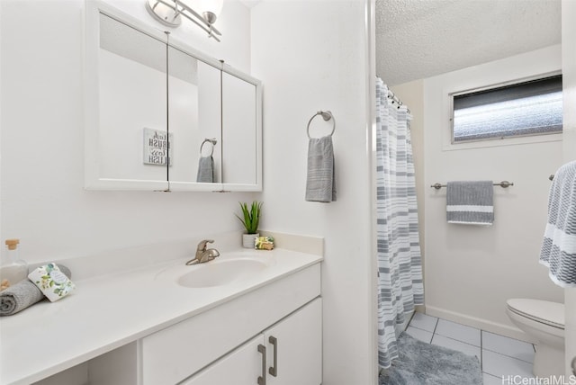 bathroom featuring tile patterned flooring, vanity, a textured ceiling, and toilet