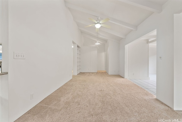 carpeted empty room with ceiling fan, high vaulted ceiling, and beamed ceiling