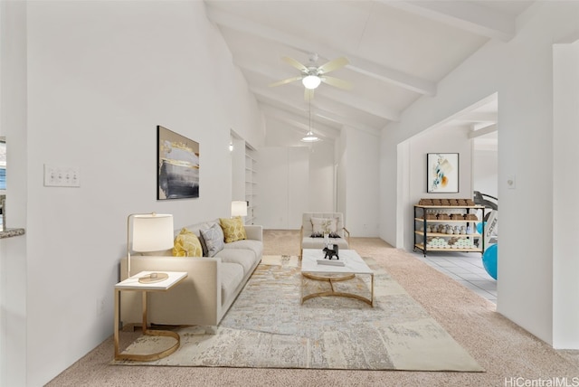 carpeted living room with beamed ceiling, ceiling fan, and high vaulted ceiling