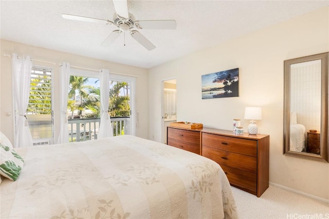 carpeted bedroom featuring access to exterior, a ceiling fan, and baseboards