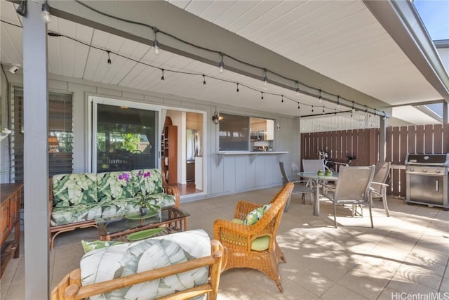 view of patio / terrace featuring outdoor dining space, an outdoor living space, fence, and grilling area