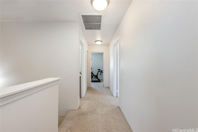 hallway with light carpet