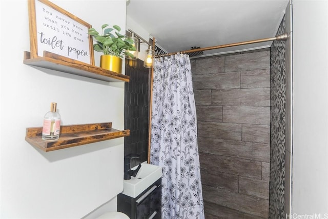 bathroom with toilet and curtained shower