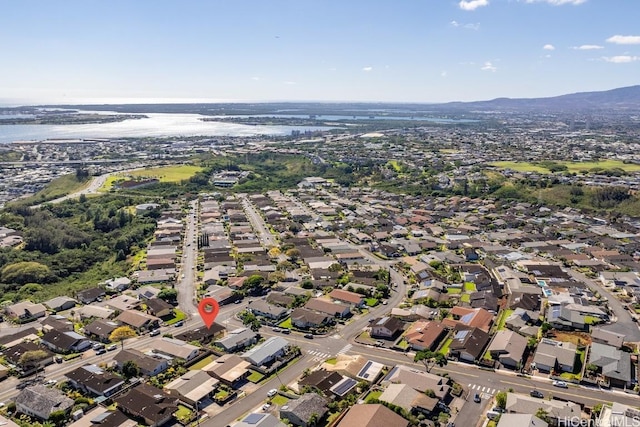 drone / aerial view with a water and mountain view