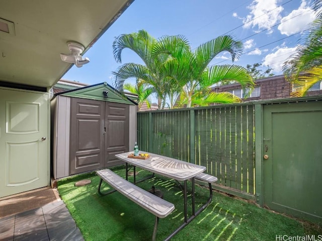 view of patio / terrace with a storage shed