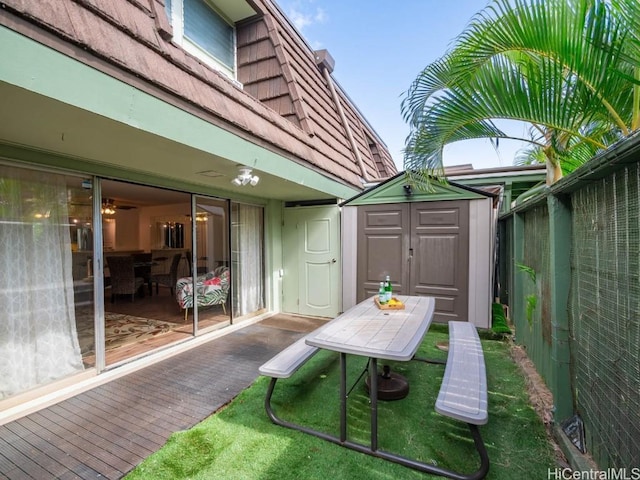 view of patio / terrace with a storage shed