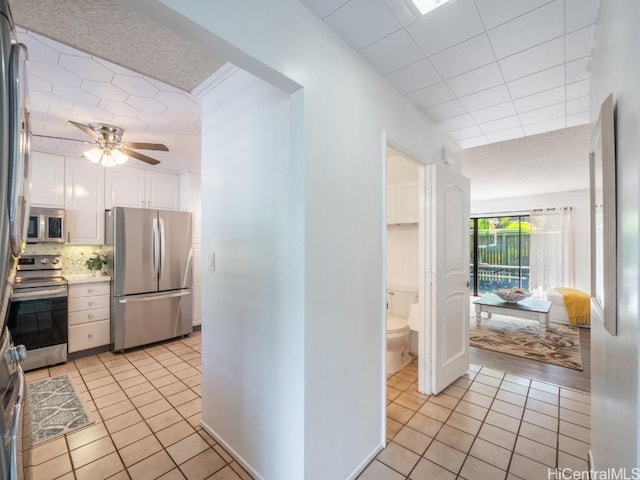 hallway with light tile patterned floors