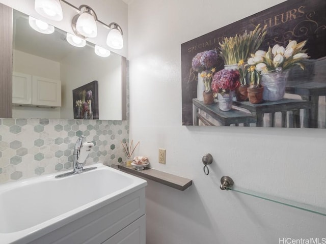 bathroom with vanity and decorative backsplash