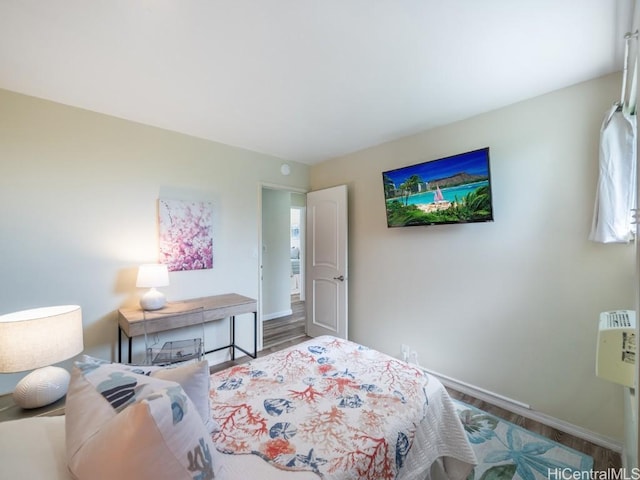 bedroom with wood-type flooring