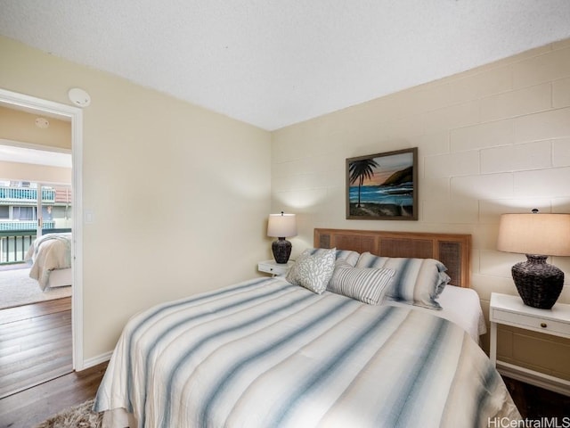 bedroom featuring dark hardwood / wood-style flooring