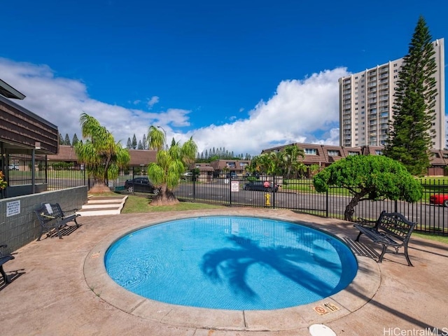 view of swimming pool with a patio area