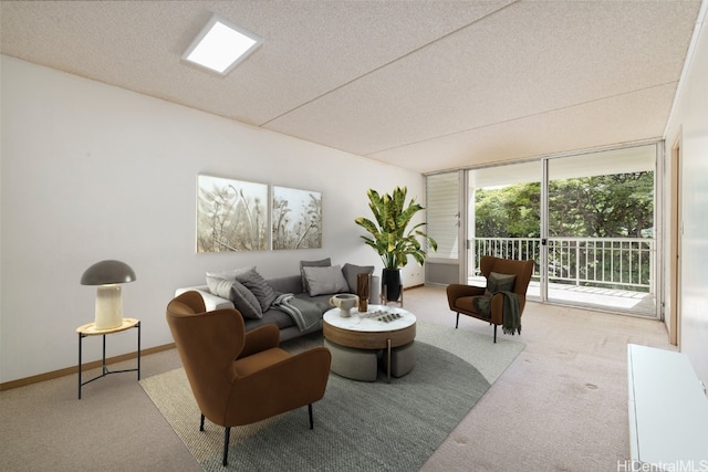 carpeted living room with a textured ceiling