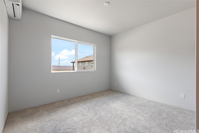 carpeted empty room with a wall mounted AC