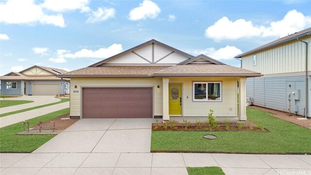 view of front facade featuring a garage and a front yard