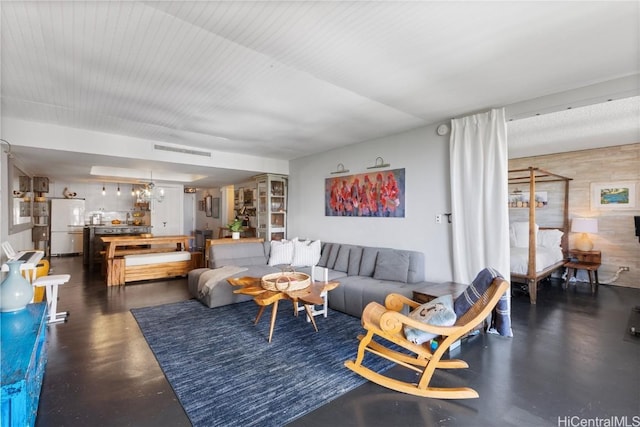 living room featuring a notable chandelier