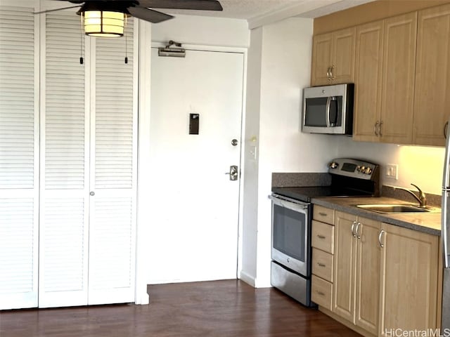 kitchen with sink, ceiling fan, stainless steel appliances, dark hardwood / wood-style floors, and light brown cabinets