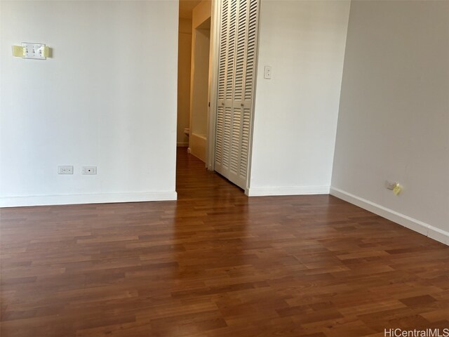 empty room featuring dark hardwood / wood-style floors