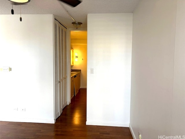 hallway featuring dark hardwood / wood-style floors