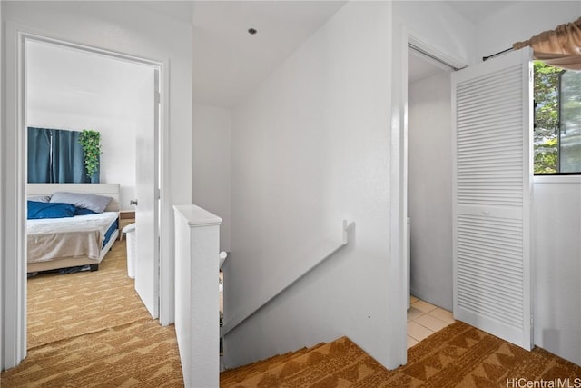 stairs featuring tile patterned floors