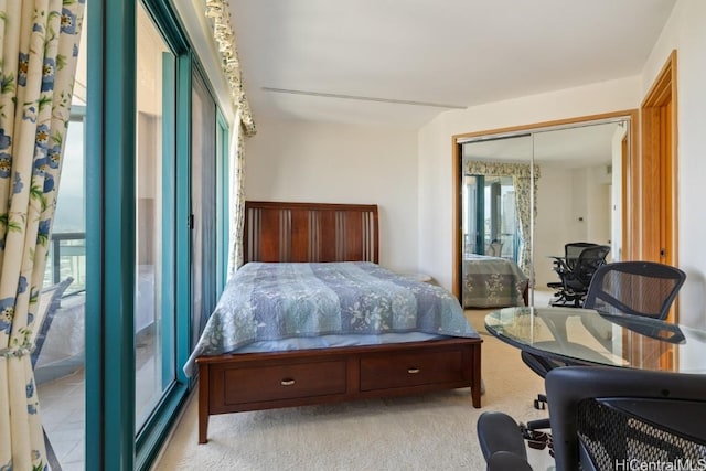 bedroom with light colored carpet and a closet