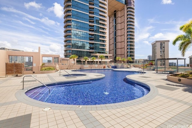 view of swimming pool featuring a patio