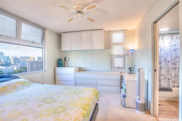 bedroom featuring a textured ceiling and ceiling fan