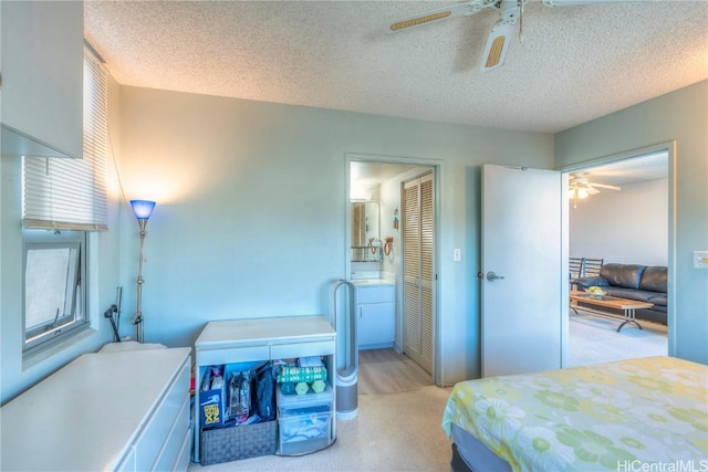 bedroom featuring a textured ceiling and ceiling fan