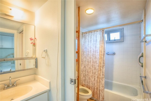 full bathroom with toilet, shower / tub combo, and vanity