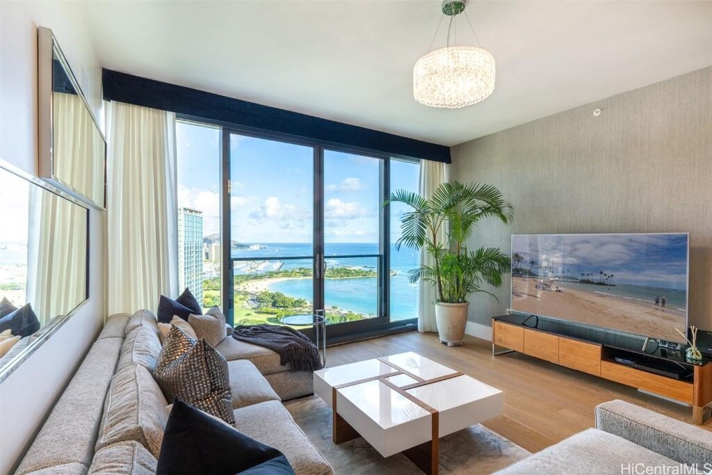 1108 Auahi St Unit Ph 3402, Honolulu, HI 96814 - living room featuring a chandelier and hardwood / wood-style floors