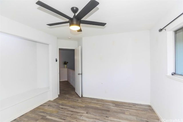 unfurnished room featuring ceiling fan and hardwood / wood-style floors