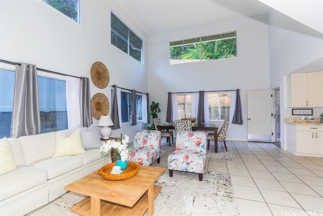 tiled living room featuring a towering ceiling