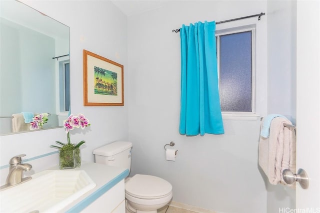 bathroom with toilet and vanity