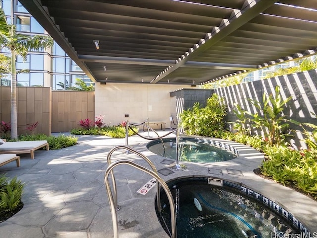 view of patio / terrace featuring a hot tub