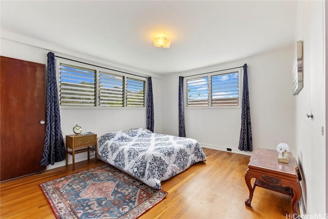 bedroom with wood finished floors