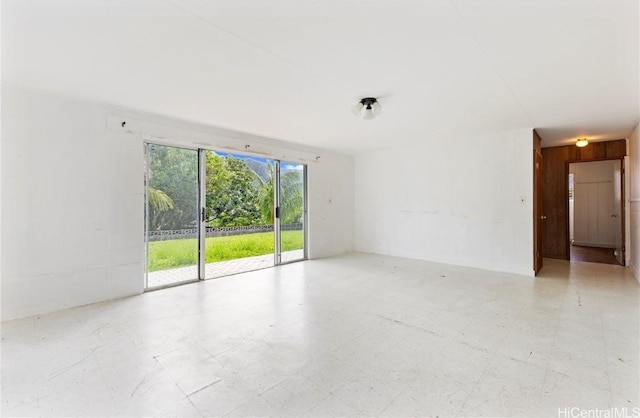 unfurnished room featuring tile patterned floors