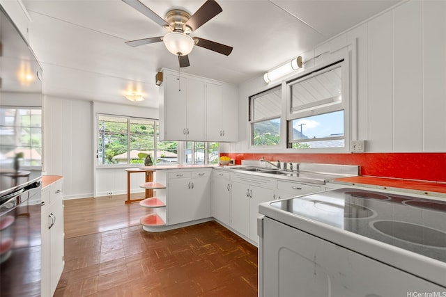 854 Hao St, Honolulu, HI 96821 - kitchen with a sink, white cabinets, white electric stove, and a wealth of natural light