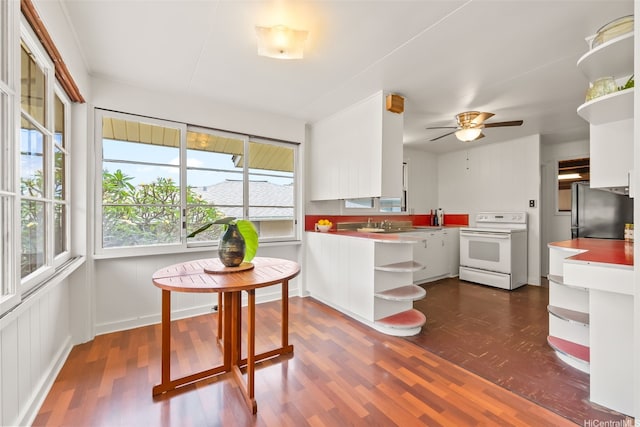854 Hao St, Honolulu, HI 96821 - kitchen featuring open shelves, white electric range, dark wood finished floors, freestanding refrigerator, and white cabinetry