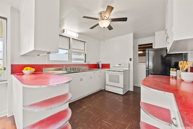 854 Hao St, Honolulu, HI 96821 - kitchen with electric range, stainless steel counters, and white cabinetry