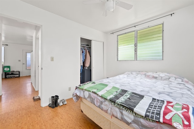 854 Hao St, Honolulu, HI 96821 - bedroom featuring a closet, baseboards, ceiling fan, and wood finished floors